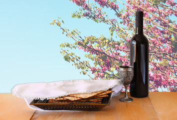 passover background. wine and matzoh (jewish passover bread) on 