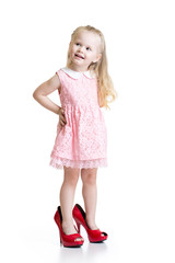 Toddler girl wearing big shoes