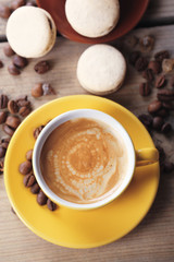 Gentle colorful macaroons and  coffee in mug