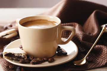 Gentle colorful macaroons and  coffee in mug