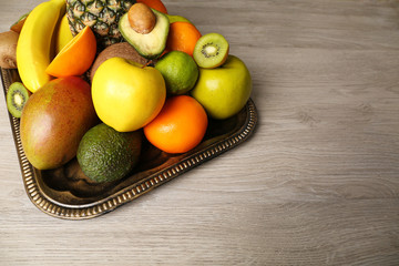 Assortment of fruits on wooden table