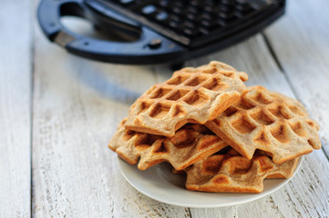 Wholegrain wheat and oat waffles with waffle-iron
