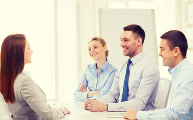 smiling businesswoman at interview in office