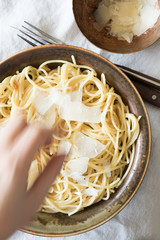 Spaghetti with Olive Oil and Garlic Served with Cheese Shavings
