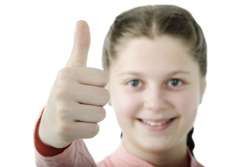 Portrait of pretty little girl showing thumb on white