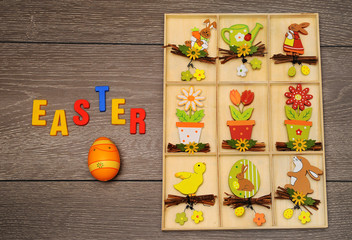 Easter eggs and decoration on wooden background