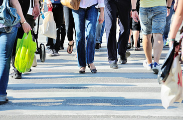 Diversified crowd crossing street