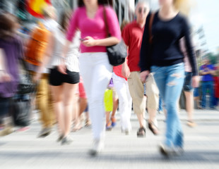 Zoom and motion blurred pedestrians on zebra crossing