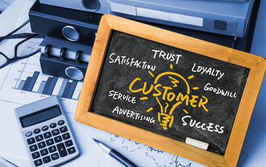 customer idea bulb handwritten on blackboard