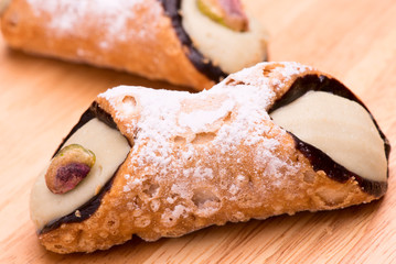 "cannolo" italian sicilian pastry with pistachio