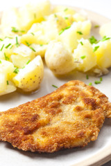 fried pork fillet with boiled unpeeled potatoes