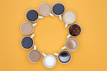 Coffee Cups Arranged in Circle Isolated on Yellow