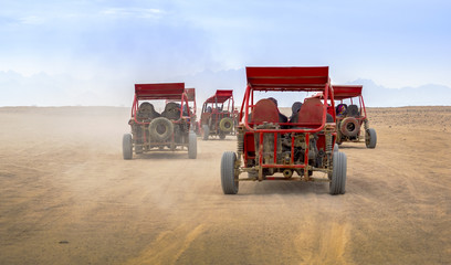 Race on buggy in a desert. © Repina Valeriya