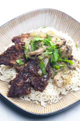 fried livres with mushroom sauce and rice