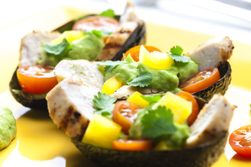 avocado filled with chicken salad and avocado dip
