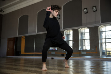 Fototapeta premium Handsome man dancing at gym