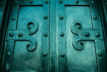 Vintage door covered with iron