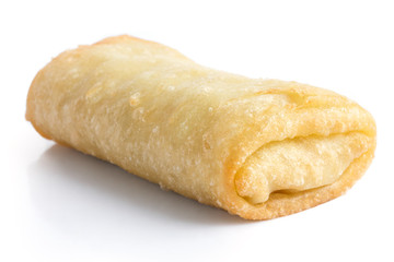 Fried chinese spring roll on white surface.