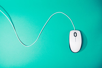computer mouse on emerald background