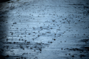 Heavy rain on asphalt