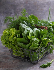 fresh herbs in a metal basket
