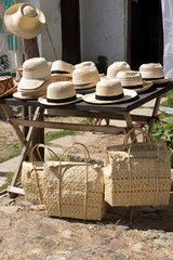 Street stall with typical straw hats and bags , Trinidad