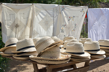 Straw hats on street stall in Trinidad