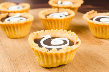 Chocolate tart on wooden board