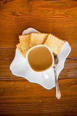 White espresso cup with biscuits
