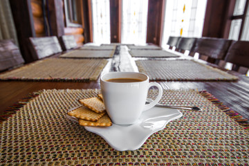 White espresso cup with biscuits