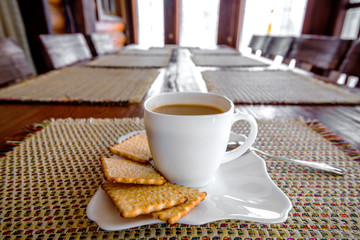 White espresso cup with biscuits