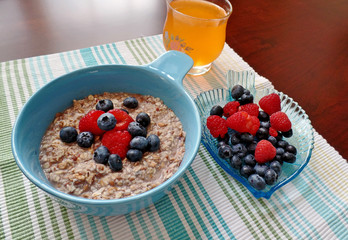 A bowl of oatmeal topped with fresh fruit