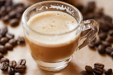 Cup of latte coffee with biscotti