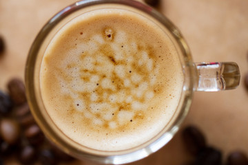 Cup of latte coffee with biscotti