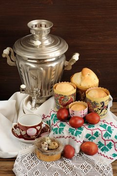 Kulichi, traditional Russian easter cakes with samovar, dyed egg