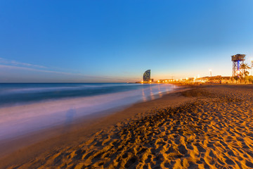 The beach of Barcelona in Spain at sunset