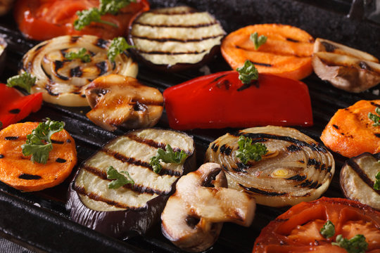vegetables cooked in a black skillet grill macro. horizontal