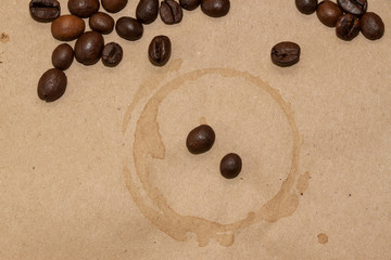 coffee beans and cup spot on kraft background