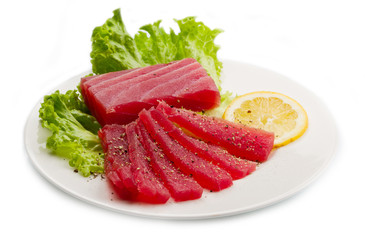Slices of raw bluefin tuna  sashimi on white dish