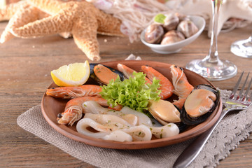 Tasty seafood on plate on table close-up