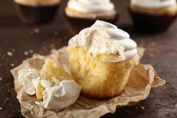 Delicious cupcakes on table close-up
