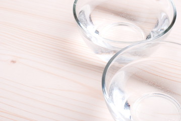 water in a glass and a napkin on the board