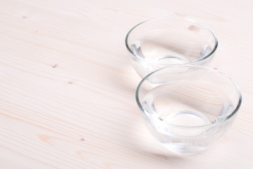water in a glass and a napkin on the board
