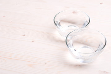 water in a glass and a napkin on the board