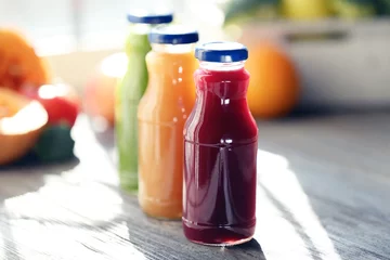 Foto auf Glas Bottles of juice with fruits and vegetables © Africa Studio