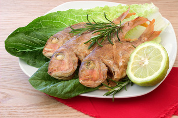 Grilled fish on a plate.