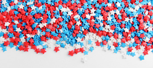 Colorful sprinkles on white background