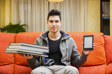 Man showing difference between ebook reader and books