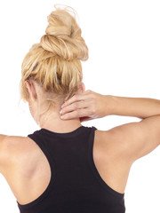 Woman holds a hand on pain neck.