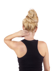 Woman holds a hand on pain neck.
